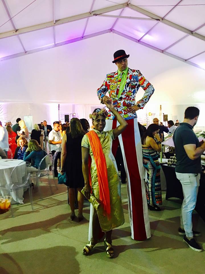 Alison Sneed frolics with the man on stilts from The National Circus Project