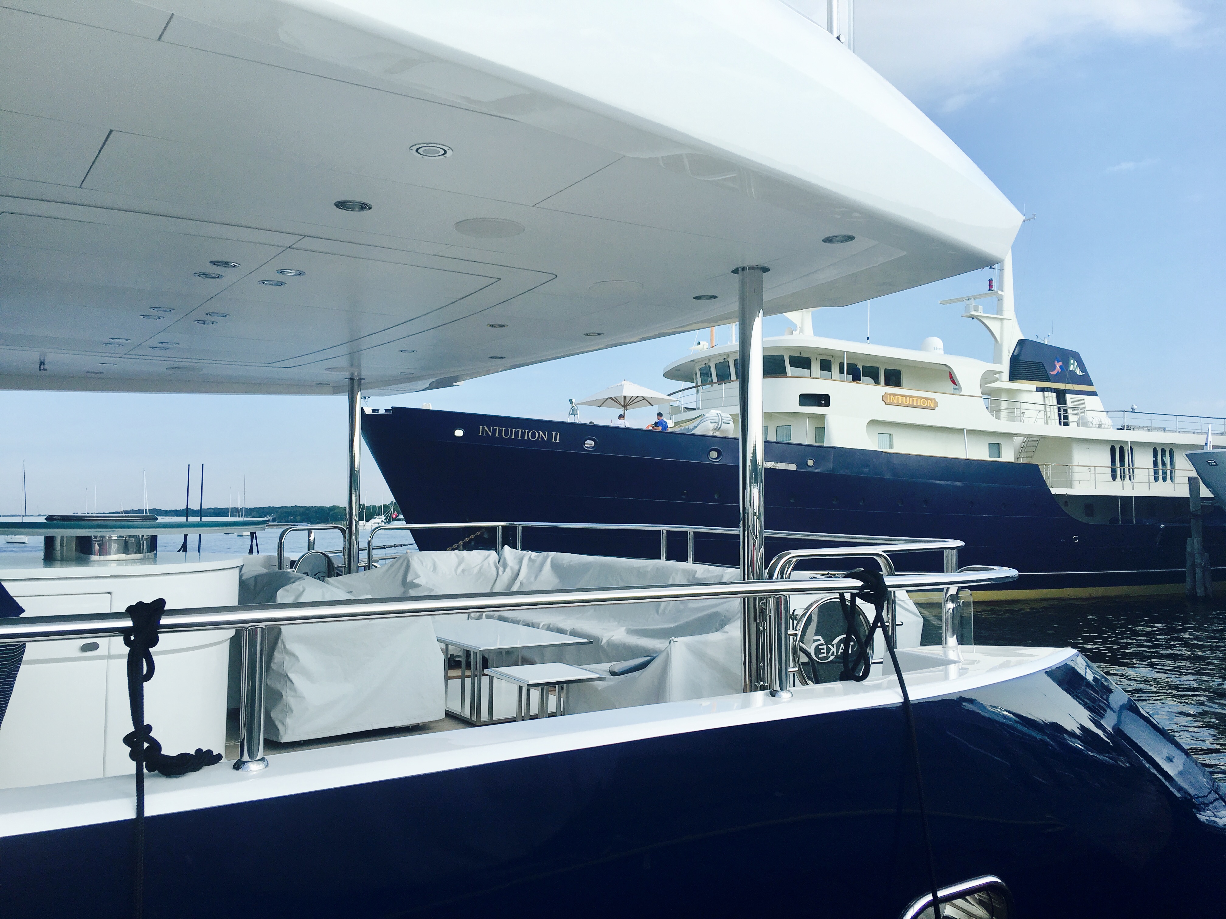 My Intuition II seen through the deck of Motor Yacht, Take 5 in Sag Harbor.